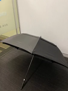 black_umbrella_on_floor