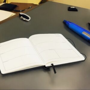 Open Diary and Pen on Work Surface 170325
