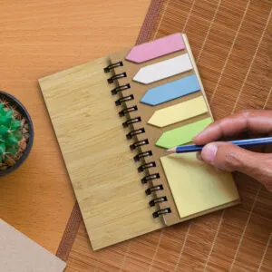 Notebook with FSC certified sticky notes on table