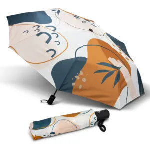 Stand out with a colorful umbrella featuring abstract patterns in teal, orange, and cream.