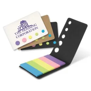 Colorful promotional sticky notes adorn an opened notebook; cover reads The Housing Corporation.