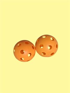 Two orange promotional pickleball balls | Brand your logo