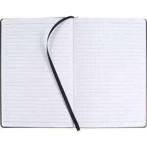 Open lined notebook with a black ribbon bookmark, perfect for diary writing.