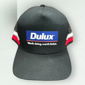 Black custom branded caps with Dulux logo and slogan
