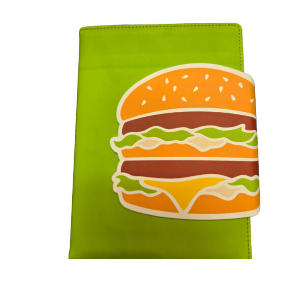 green notebook with a burger artwork on the side