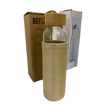Bottle with bamboo lid and sleeves and two boxes behind