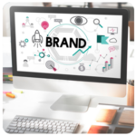 Computer screen displaying BRAND with marketing icons, highlighting key business goals.