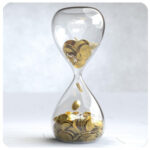 Hourglass filled with gold coins, symbolizing time and business goals flowing to success.