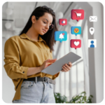 Woman using a tablet with business goals, social media, and shopping icons floating around her.