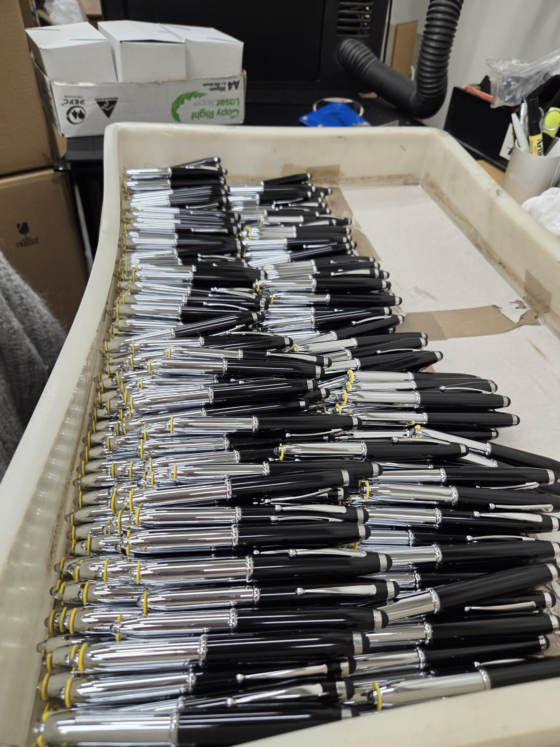 A large tray filled with neatly arranged pens, perfect for your recommendations.