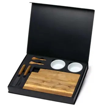 Cheese board set with knives, two bowls, and a wooden cutting board in a black box.