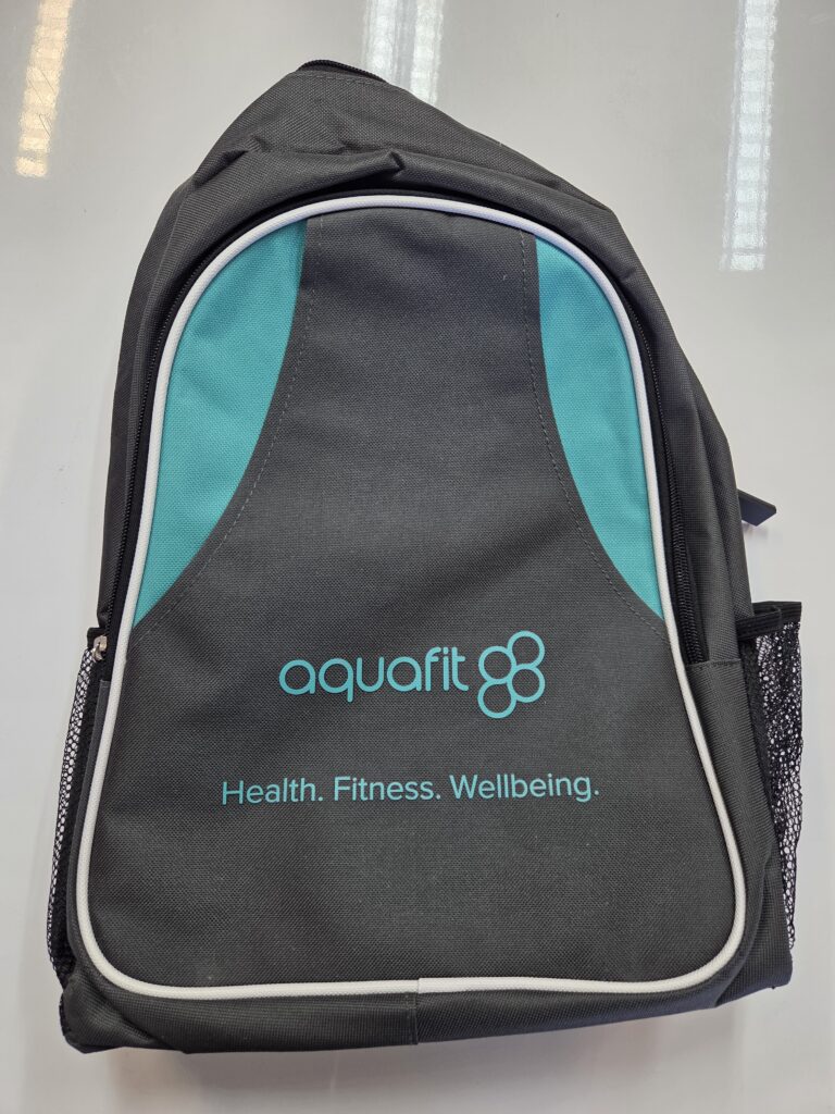 A gray and teal Aquafit backpack bag with Health. Fitness. Wellbeing. printed on the front.