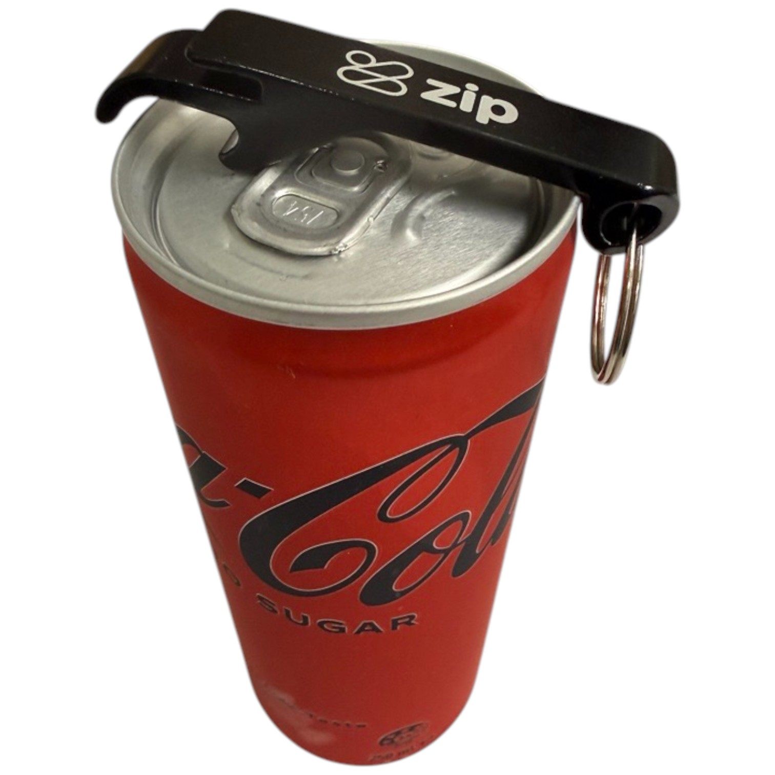 Black bottle key opener with zip logo opens a red Coca-Cola can.