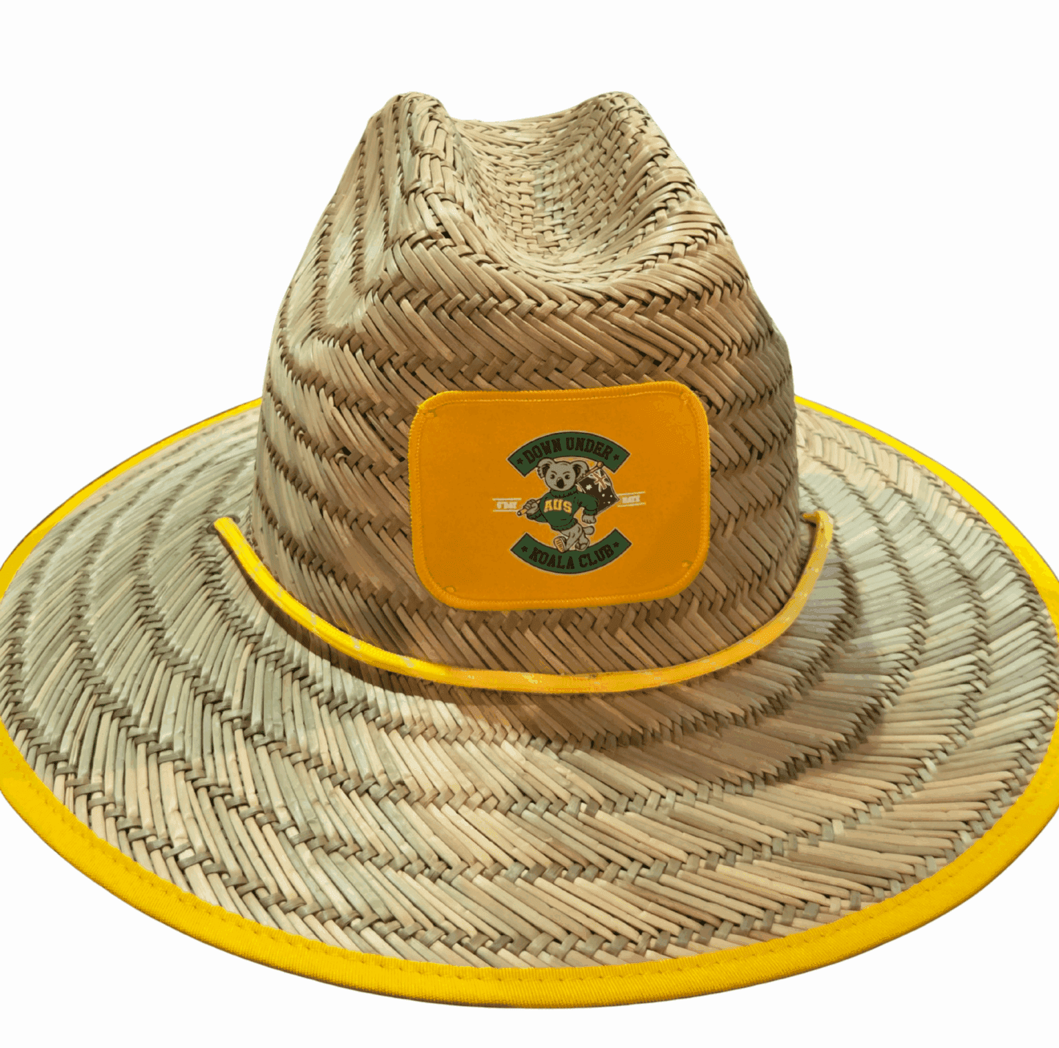 Straw hat with a yellow rim and a patch featuring the letter S and green graphics on the front. 