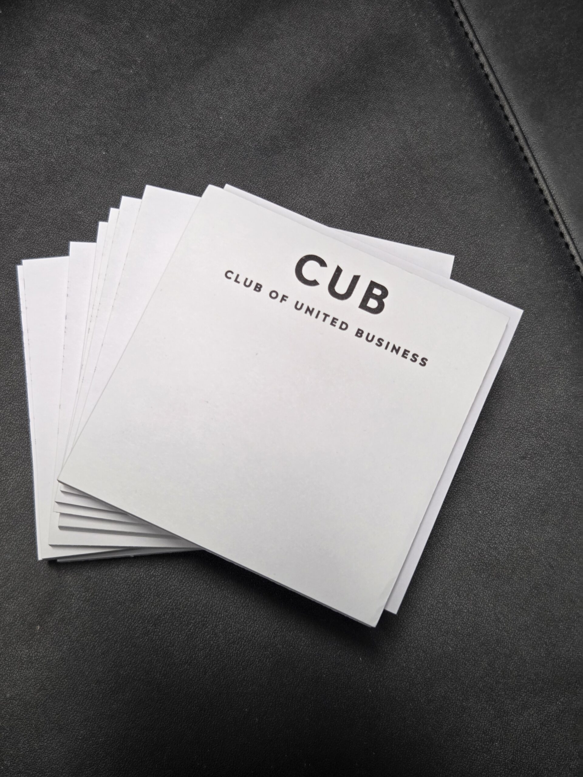 sticky notepads printed with CUB logo arranged neatly