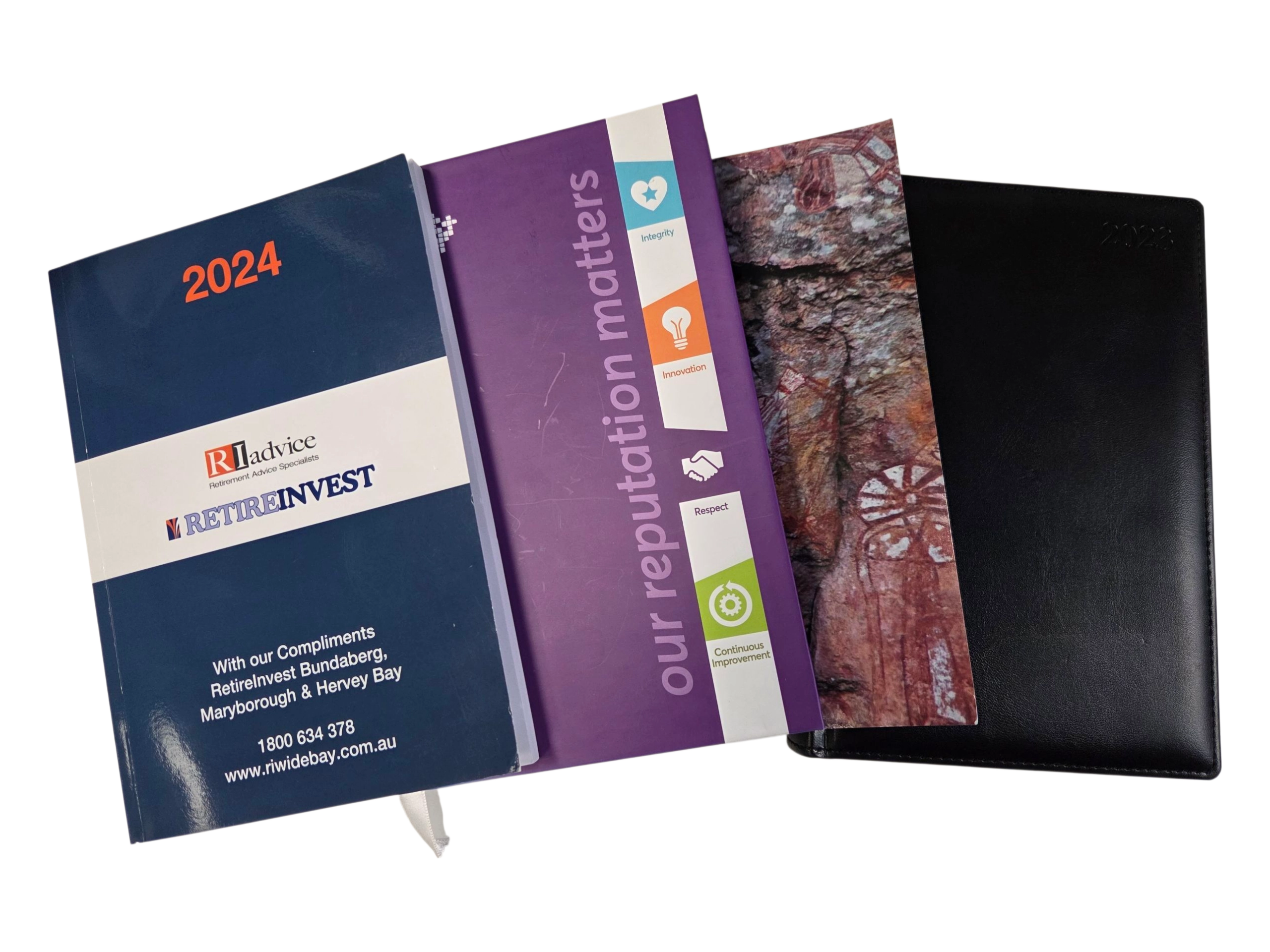 Four 2024 diaries overlap, each with a unique cover—perfect for any buying guide for diaries.