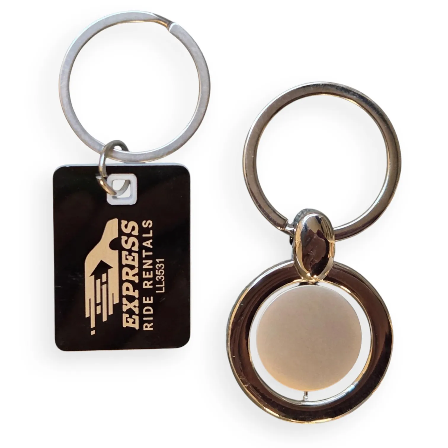 Two metal keychains, showcasing the durability of metal vs plastic keyrings.
