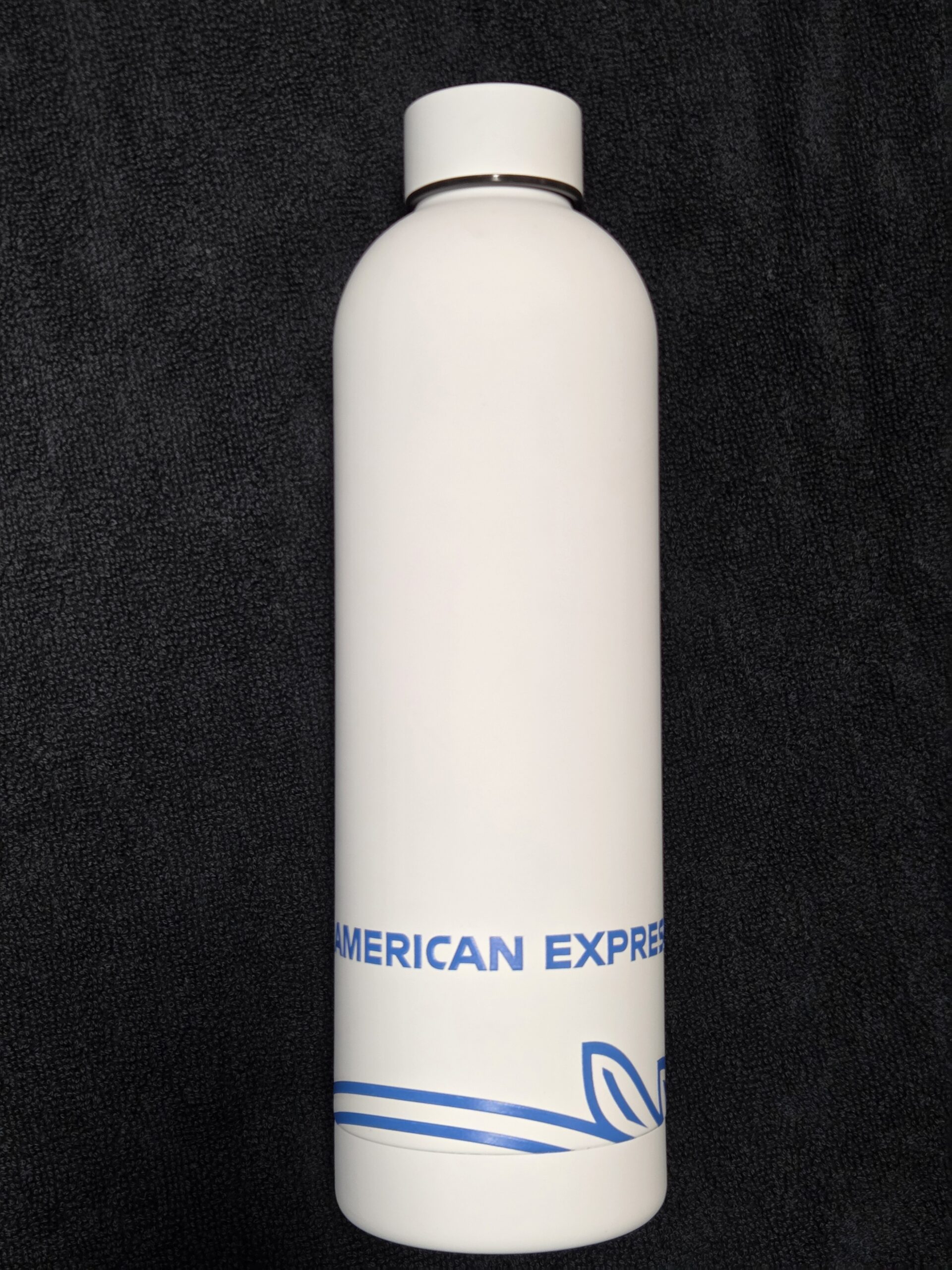 white metal bottle with american express logo at the bottom part