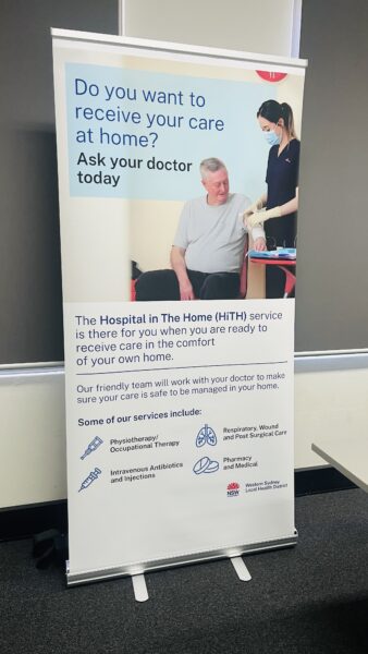 Banner promoting rebrand of at-home hospital care, with a nurse aiding a seated older man.