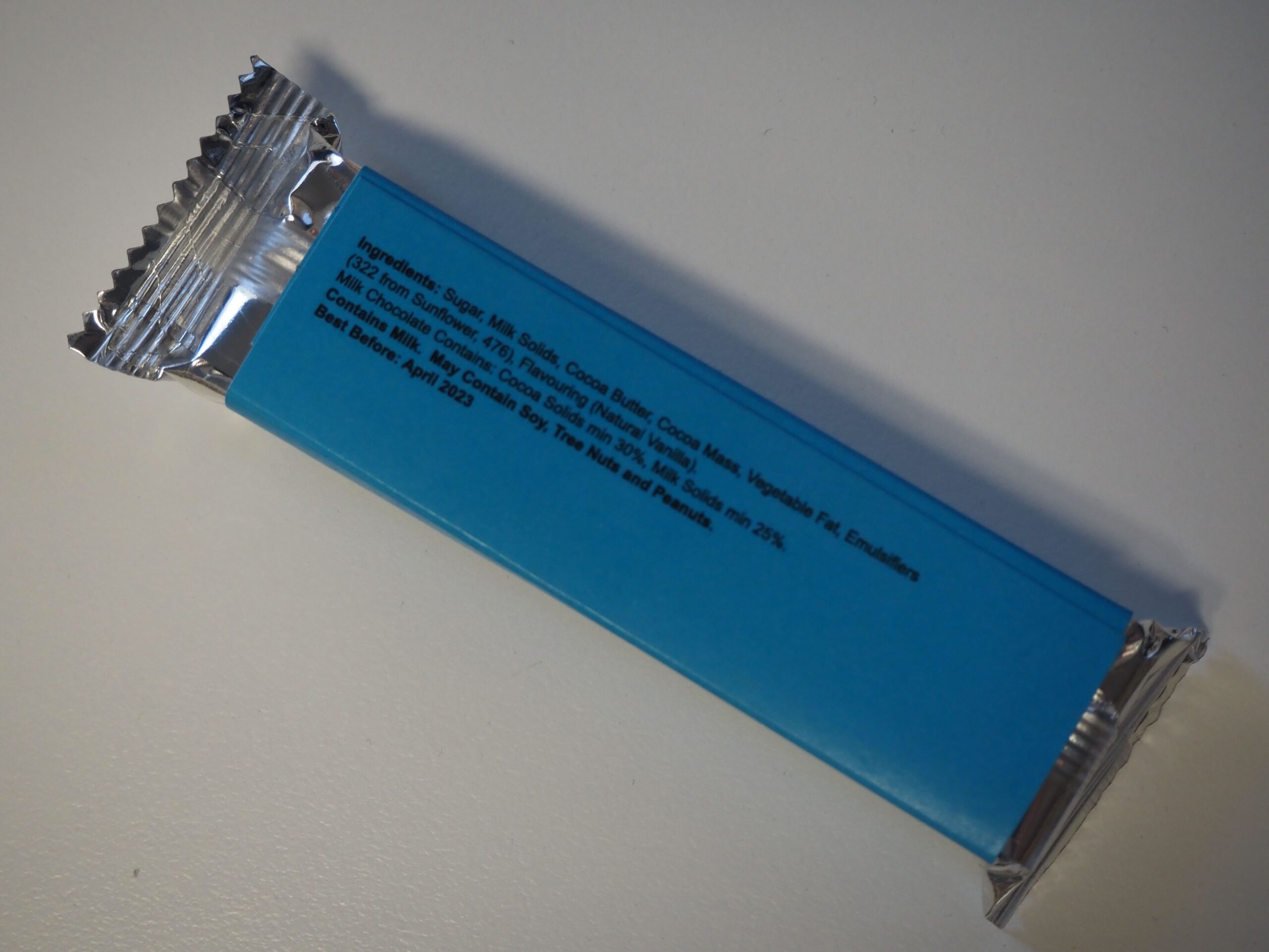 A blue-wrapped chocolate bar featuring BOSBroker Division details on the back.