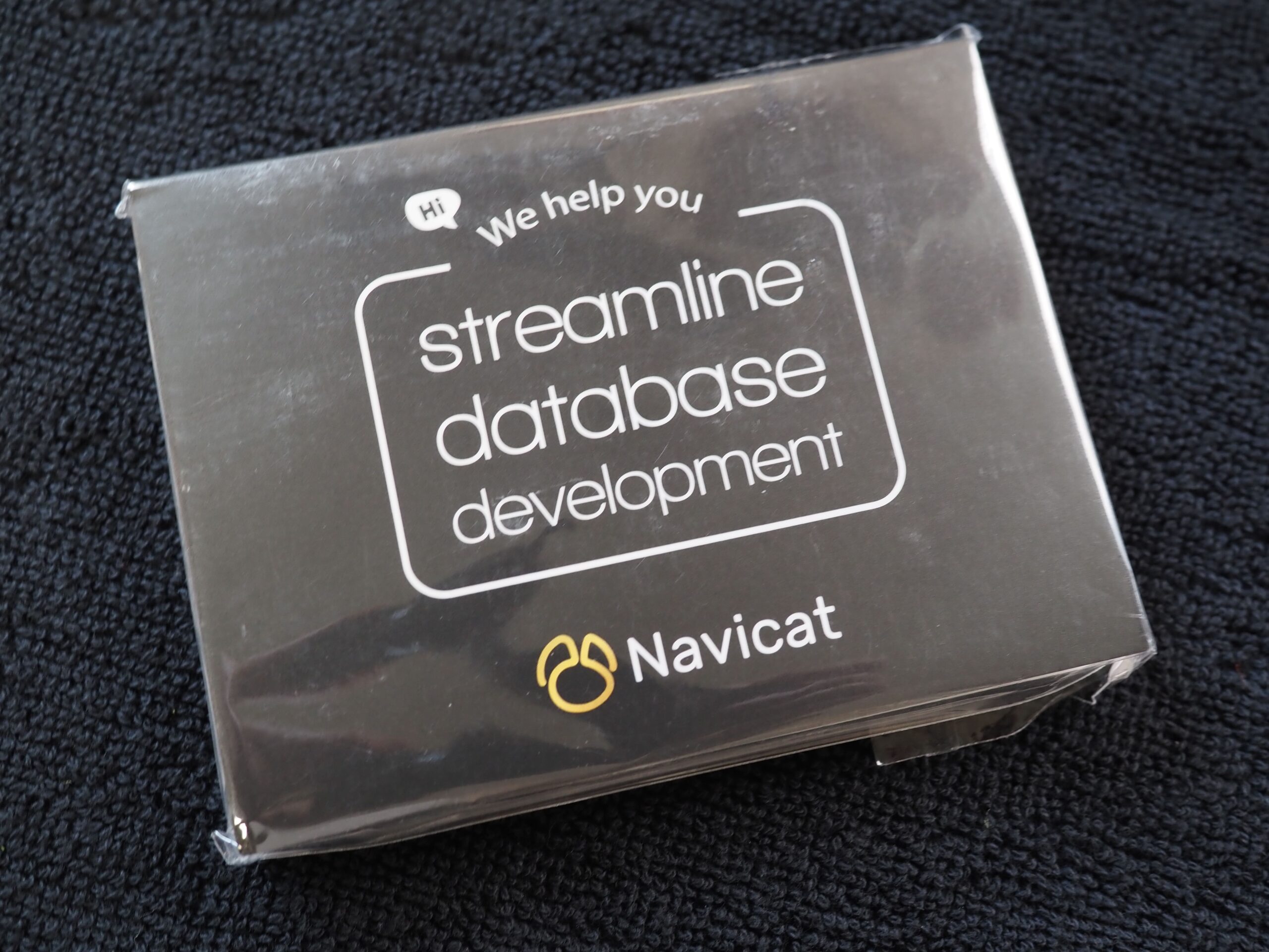 A Navicat card reads PremiumSoft helps you streamline database development on a dark background.