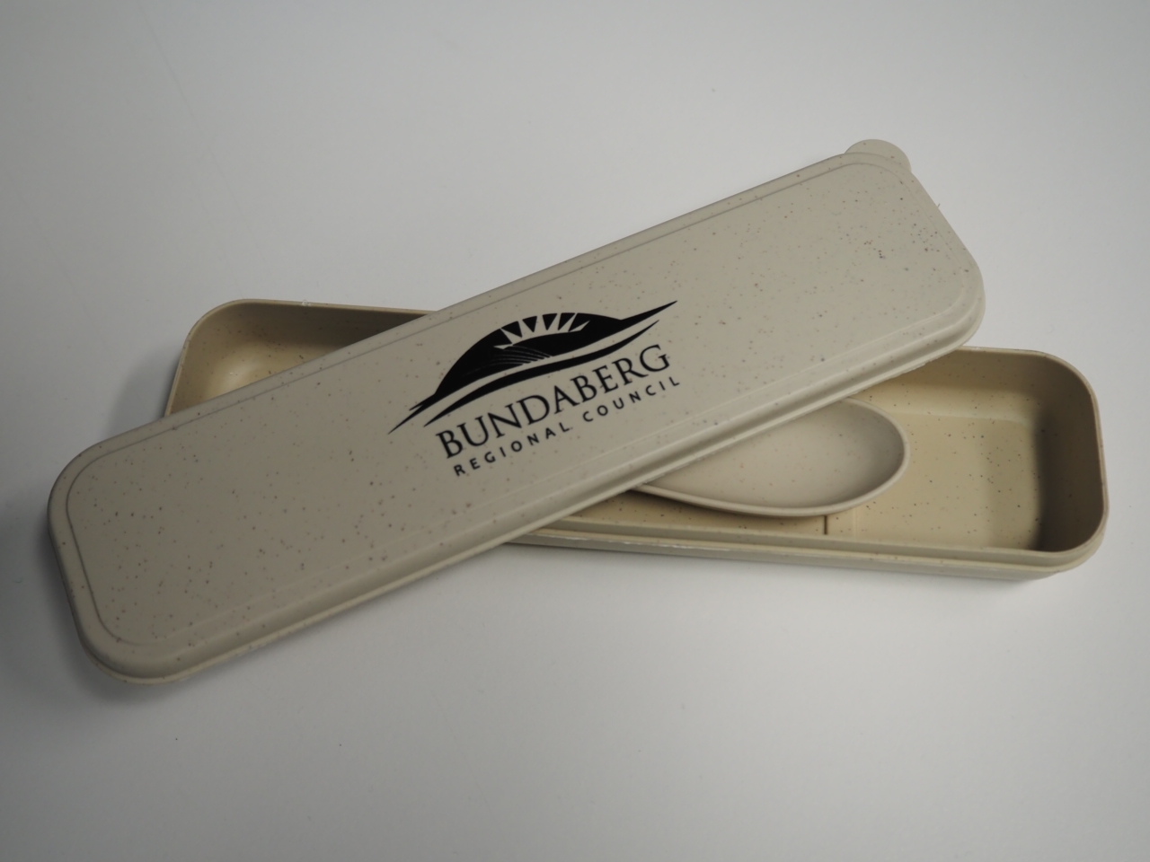 Beige cutlery case with Bundaberg Regional Council logo, partially open to display a spoon.