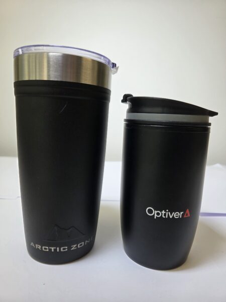 Two black travel mugs, perfect as gifts, labeled ARCTIC ZONE and Optiver on a white surface.