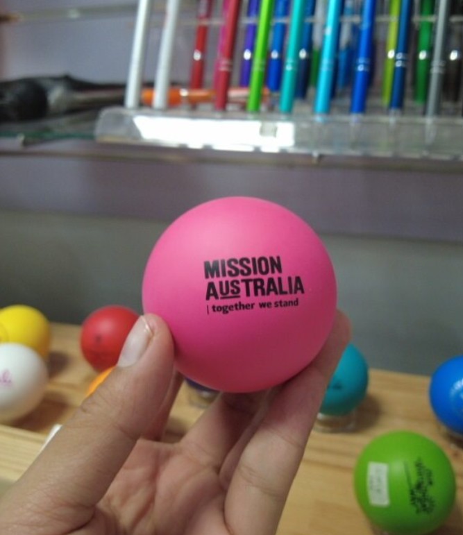 A hand holds one of the funnest promotional items—a pink ball labeled MISSION AUSTRALIA.