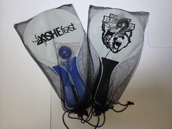 Two paddle sets in mesh bags, perfect gifts with blue and black handles and unique designs.