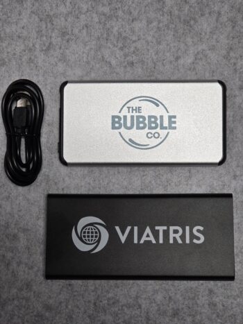 Two branded power banks and a black USB cable—perfect as practical Christmas gifts.