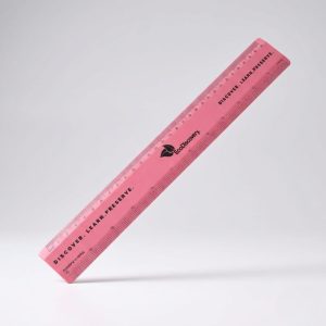 A pink plastic ruler, Australian-made promotional item, with black markings on a light background.