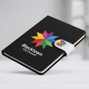 A black promotional notebook with Blacktown City Council and a colorful star logo on the cover.