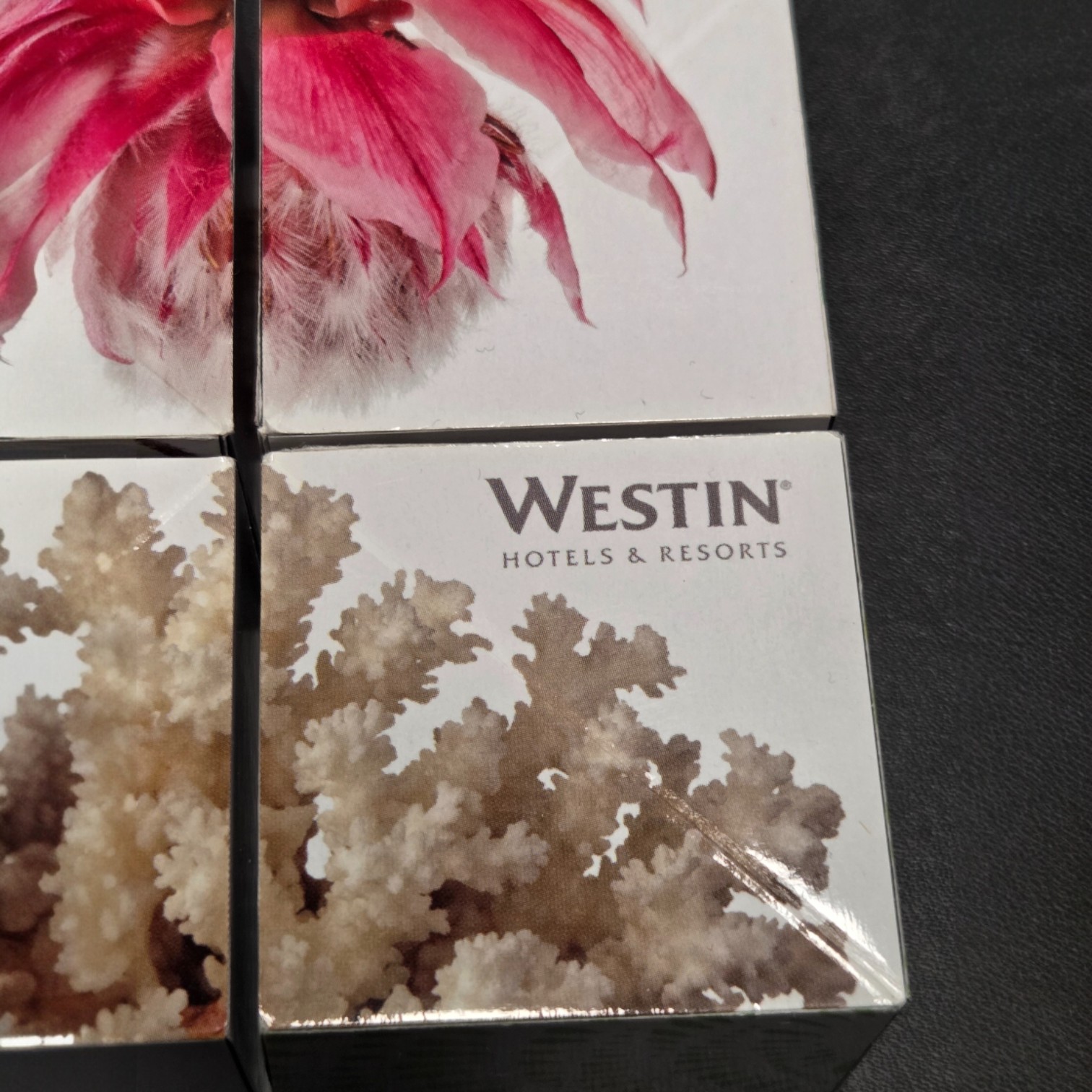 Westin Hotels & Resorts logo on a box with coral, flowers, and print colour accuracy.