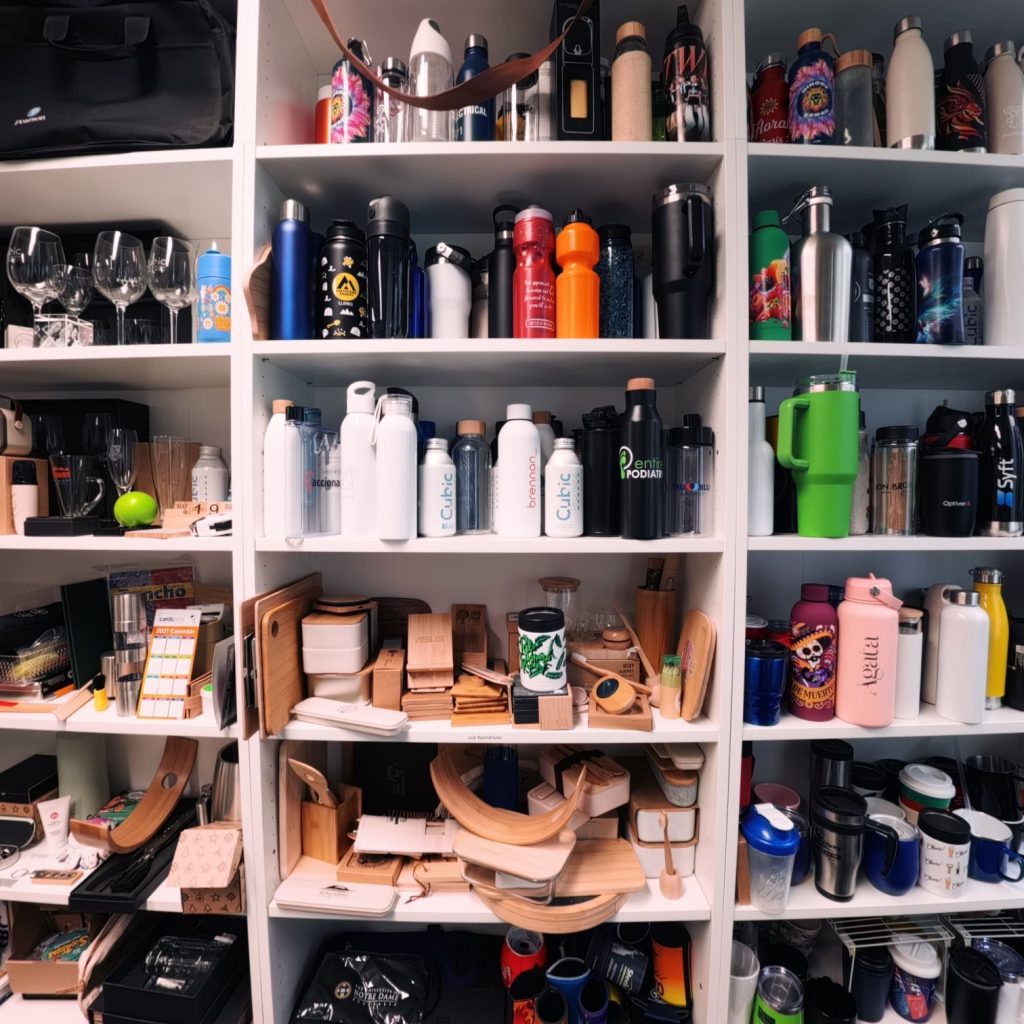 Shelves filled with water bottles, mugs, and glassware reflect merchandise trends 2026.