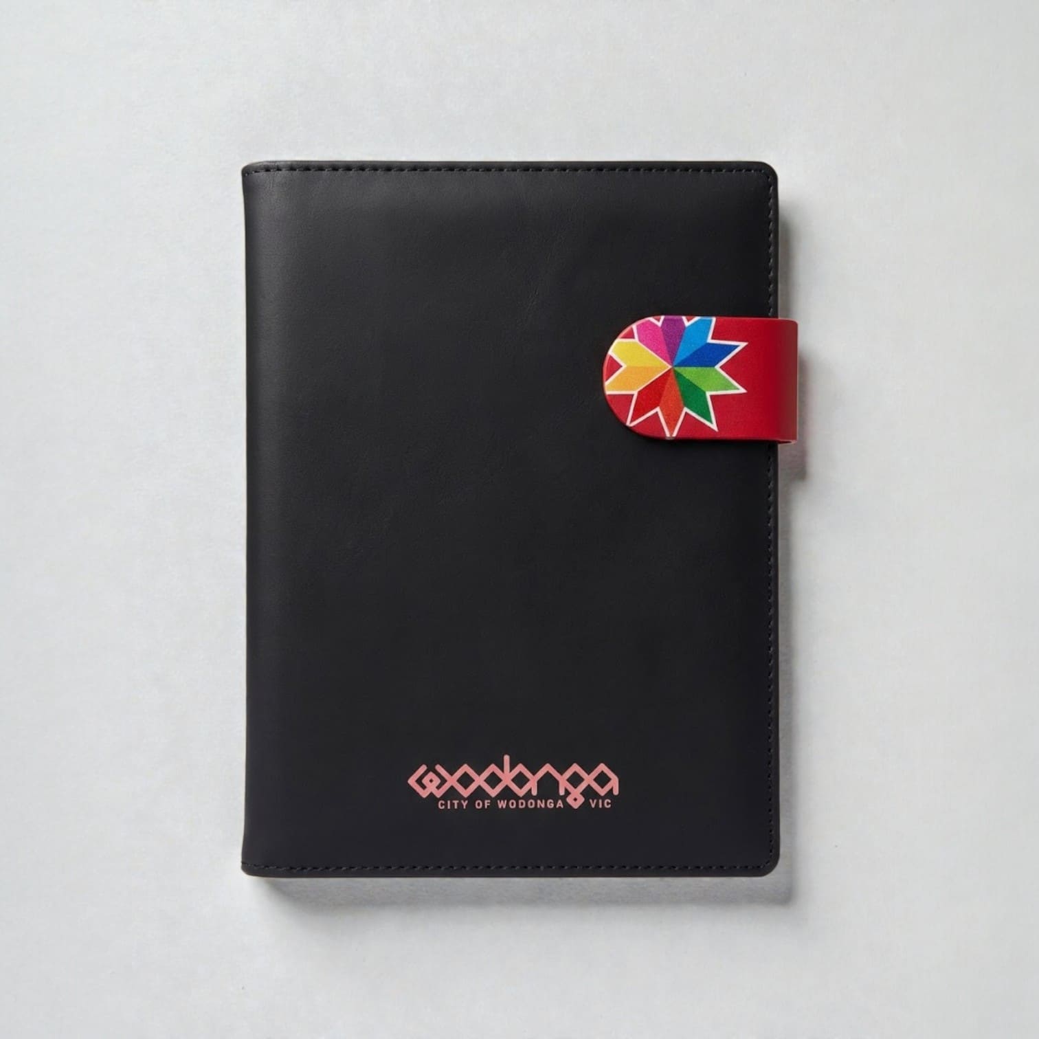 Black notebook with a colorful clasp—perfect promotional product for Australia accounting firms.