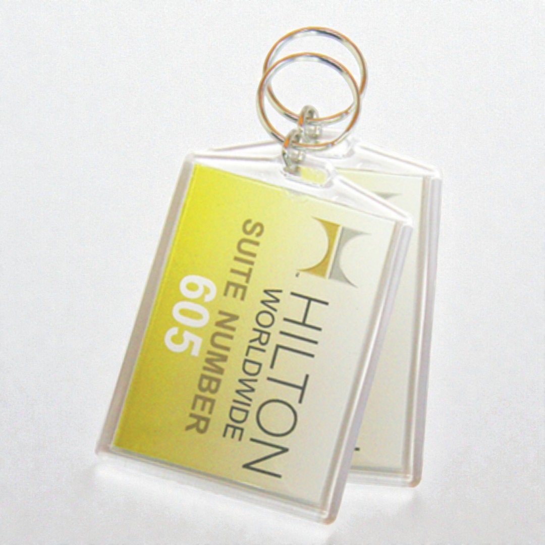 Two Hilton Worldwide suite keychains—an elegant take on bamboo vs plastic promotional items.