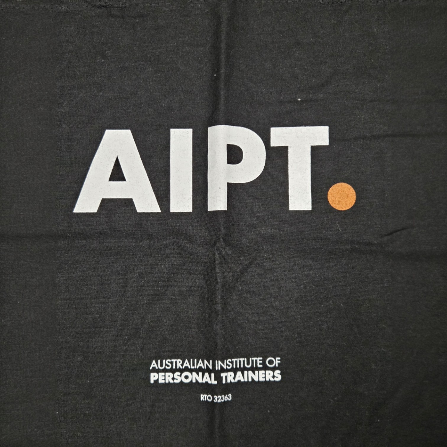 Black cloth with AIPT. in bold, featuring print colour accuracy for a sharp, clear logo.