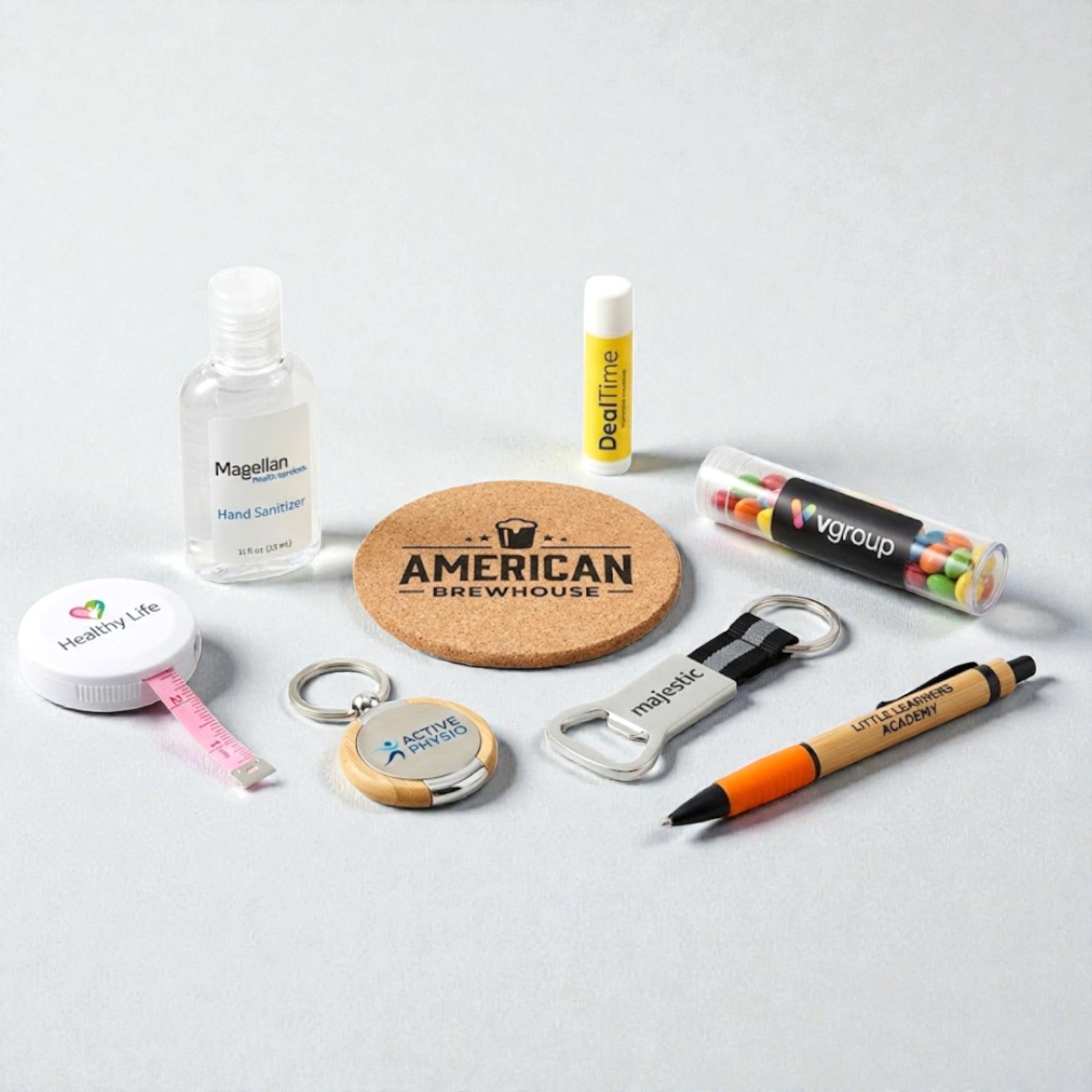 Assorted promotional products under $5 like sanitizer, pen, tape measure, candies, and coasters.