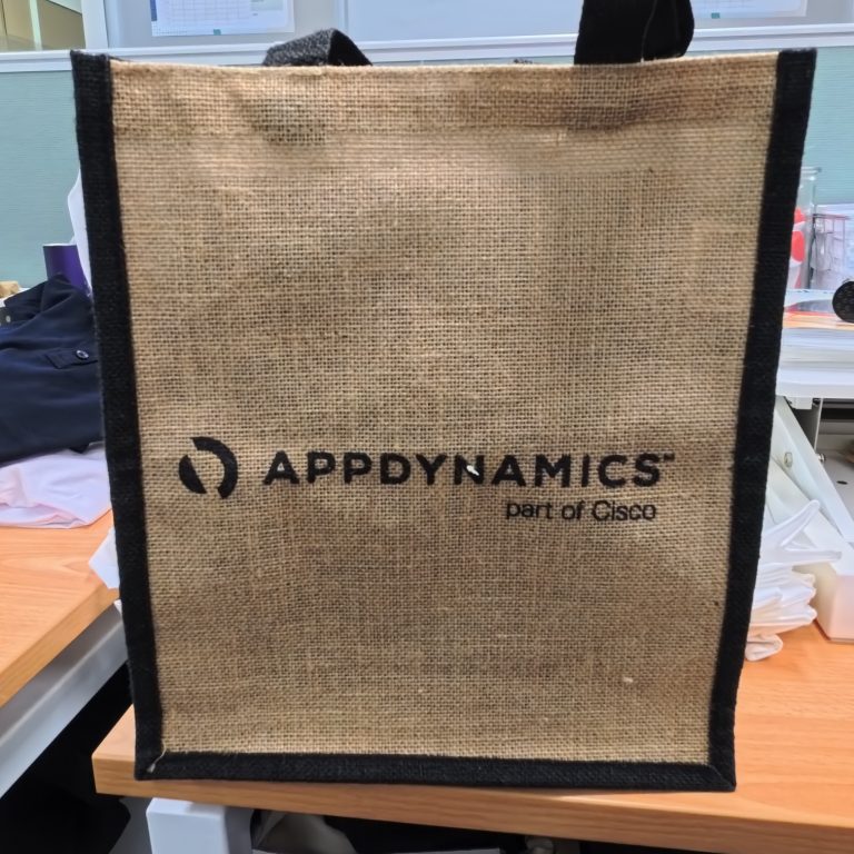 A jute tote bag—one of the top promotional items 2025—with AppDynamics part of Cisco printed on front.