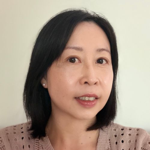 Meet the team: woman with straight black hair and a light pink sweater, smiling at the camera.