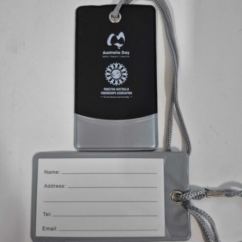 Two grey luggage tags, one with Australia Day logo, one with blank fields for contact details.