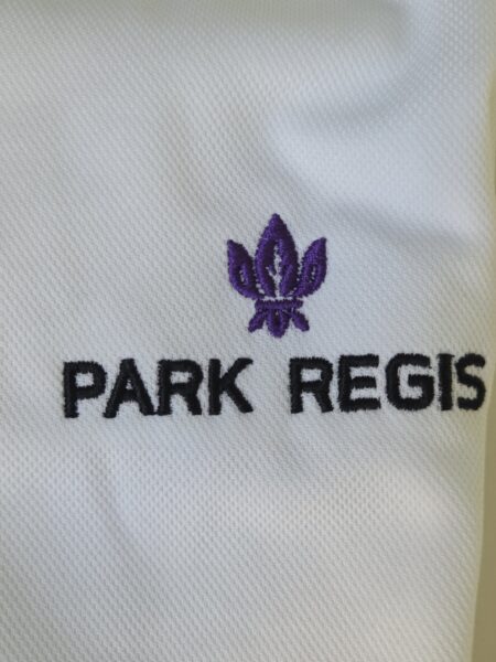 White fabric with a purple fleur-de-lis, perfect for account managers and order management needs.