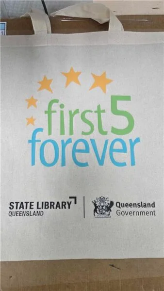 A tote bag—great for gift ideas or event gifts—with first 5 forever and SLQ logos.