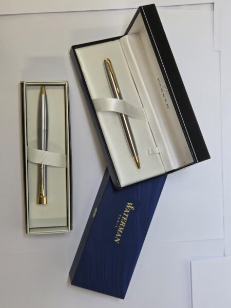 Two elegant pens in gift boxes, ideal as gifts for event clean-up or large gatherings.